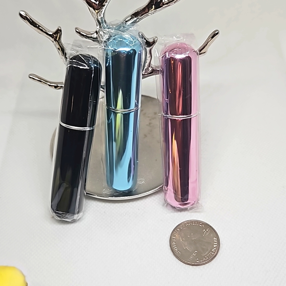 Three Refillable Travel Perfume Atomizers.  Colors vary.